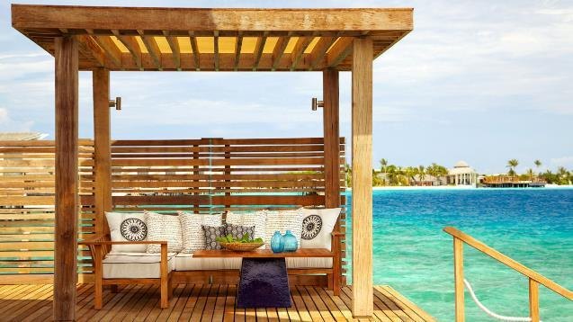Waterfront cabana with timber pergola
